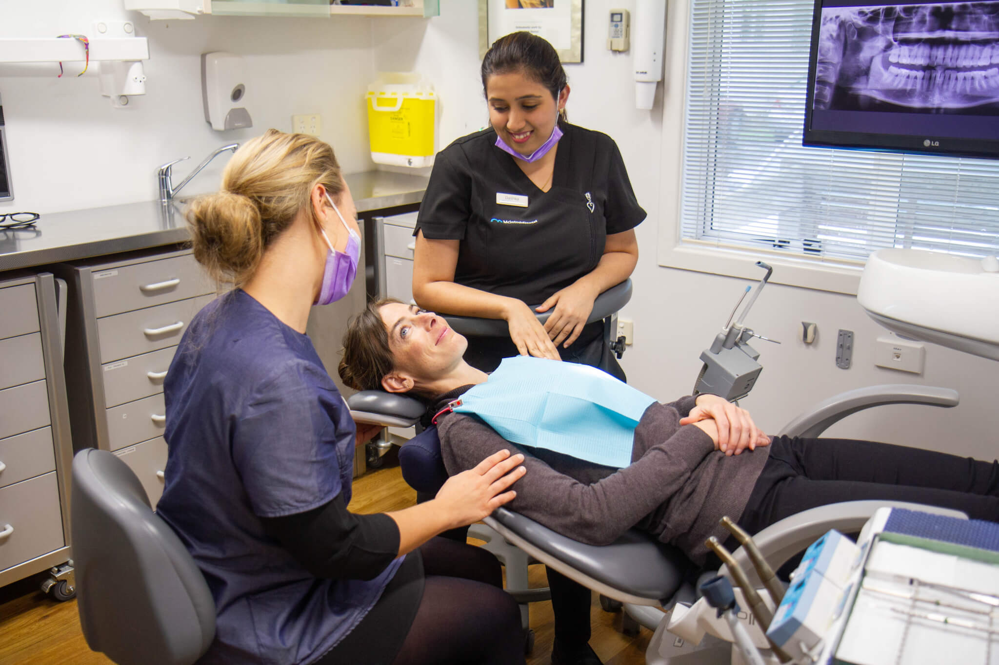 Dental fillings, patient in dentist chair getting a filling