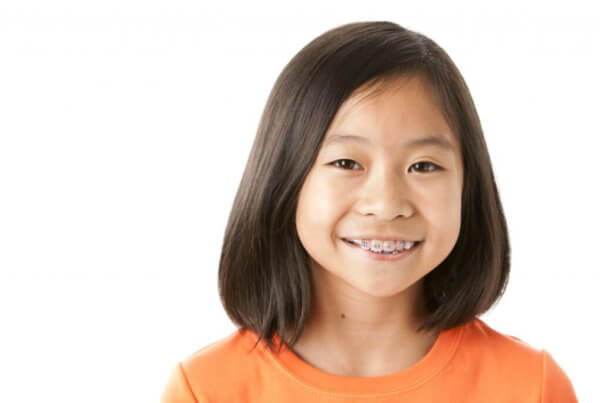 OrthoPlan affordable orthodontic payment plan, girl with braces smiling