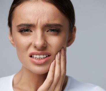 Toothache, woman with painful tooth