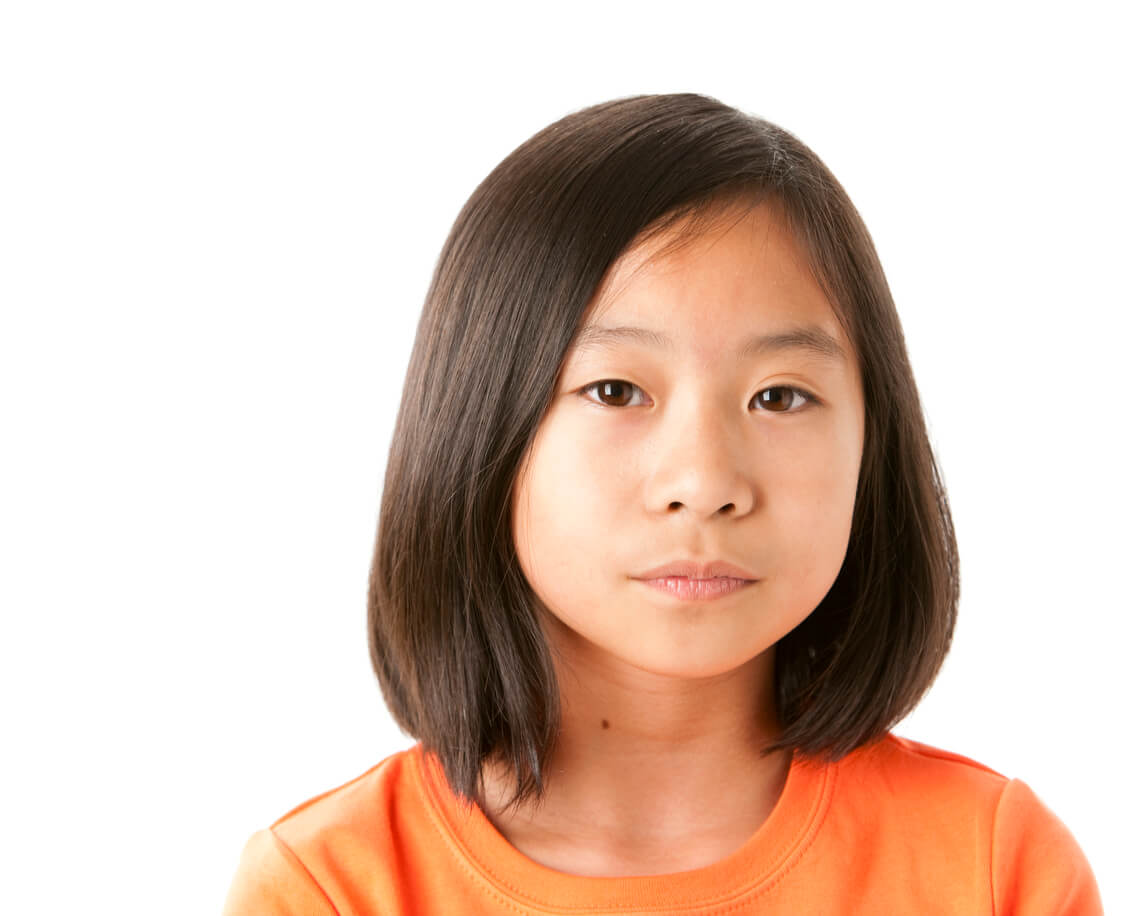 Serious Asian Little Girl Closeup Headshot Orthodontics for kids, girl looking serious