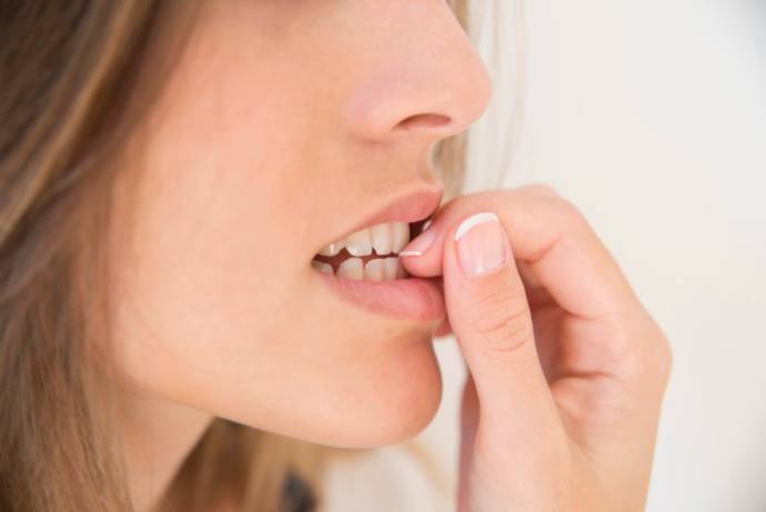 effects of nail biting on oral health